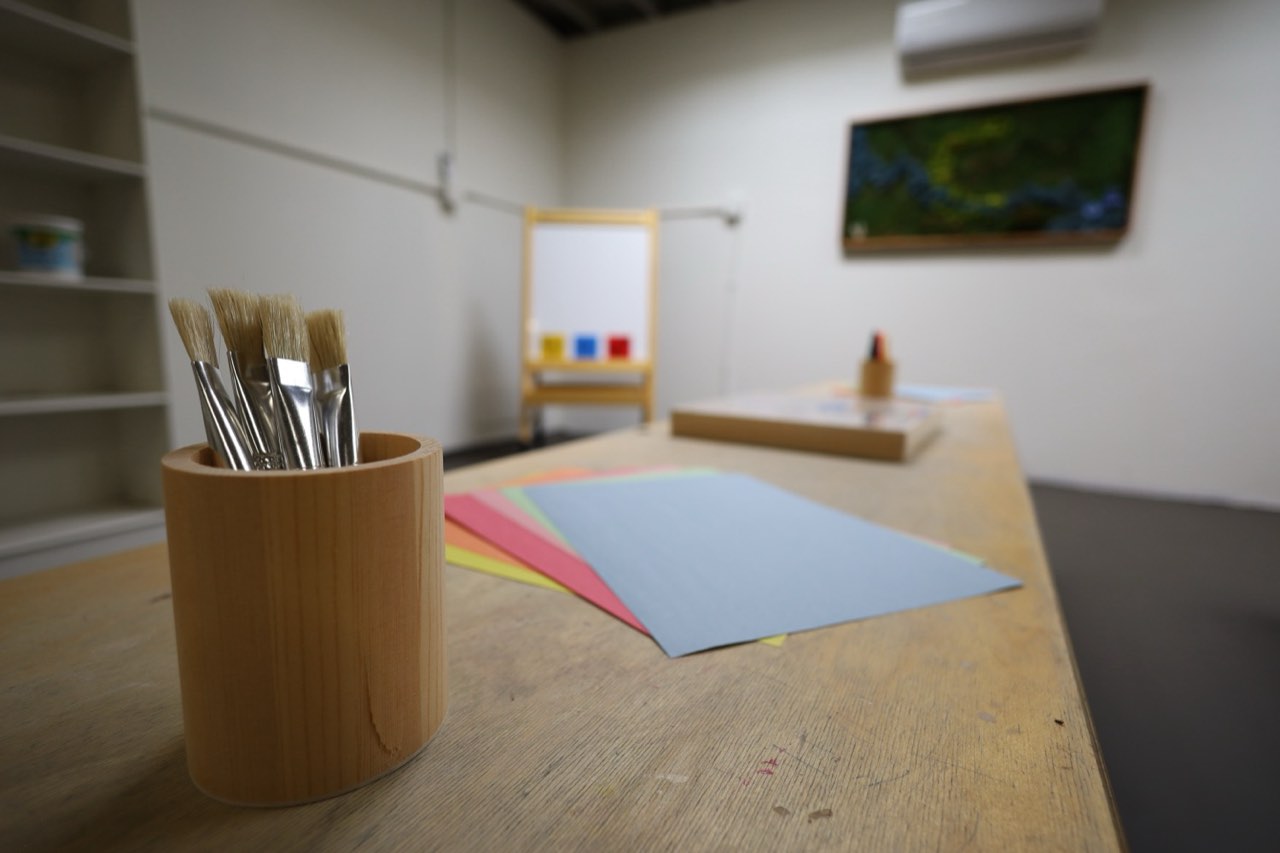 Art room with brushes and colored paper